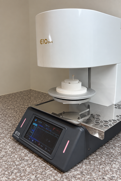 E10 Plus dental porcelain furnace with a dental restoration positioned on its ceramic firing support