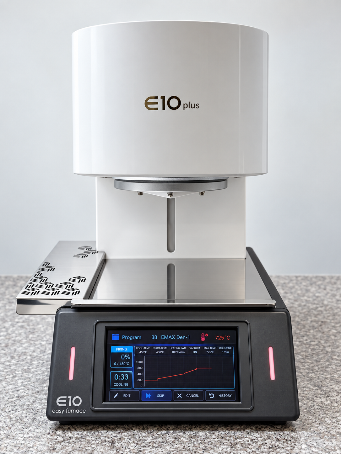 E10 Plus dental porcelain furnace on a lab workbench, showing firing cycle graph and touchscreen controls