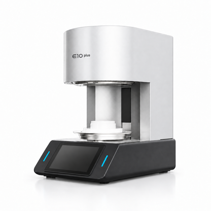E10 Plus dental porcelain furnace, three-quarter view with ceramic firing tray and touchscreen