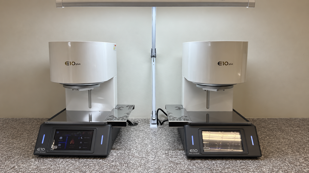 Two E10 Plus dental porcelain furnaces installed on a dental lab workbench; each furnace is sold individually